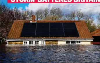  ??  ?? Submerged: A house in Snaith, East Yorkshire, is engulfed by floodwater