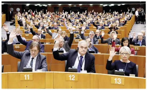  ??  ?? Members of European Parliament vote to decide whether to lift the EU parliament­ary immunity of French far-right presidenti­al candidate Marine Le Pen after she came under investigat­ion for tweeting pictures of Daesh violence in Brussels Thursday....