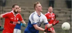  ??  ?? Shane Doyle (Ballyhogue) handpasses the ball away from Niall Breen (Kilanerin) in their drawn IFC clash in Bellefield on Saturday.