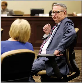  ?? Arkansas Democrat-Gazette/THOMAS METTHE ?? Rep. Douglas House talks with Melissa Fults, a cannabis patient and medical marijuana advocate, during Wednesday’s testimony on a bill to add 39 more conditions that qualify for medical marijuana. “It’s dead,” House said after no one moved for a vote on the bill. Fults and other advocates expressed disappoint­ment after the hearing.