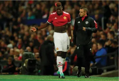  ?? REUTERS ?? IN BAD SHAPE: Paul Pogba faces a few weeks on the sidelines after sustaining a hamstring injury against Basel on Tuesday.