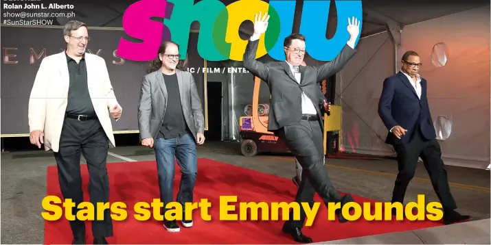  ?? AP PHOTO ?? ROLLOUT. Emmy 2017 host Stephen Colbert (second from right) leads the rollout of the Emmy red carpet for Sunday's awarding ceremony. From left, Ricky Kirshner, Glenn Weiss, Colbert and Hayma Washington.