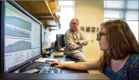  ??  ?? Jacque Miller, a graduate student at the University of Maine, and Joseph Kelley review radar data gathered from a shell midden in a lab. Archaeolog­ists in Maine are working to unearth artifacts buried for centuries in shell middens.