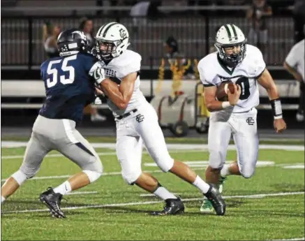  ?? RANDY MEYERS — THE MORNING JOURNAL ?? Leighton Banjoff of Elyria Catholic runs for a big gain through the Valley Forge defense.