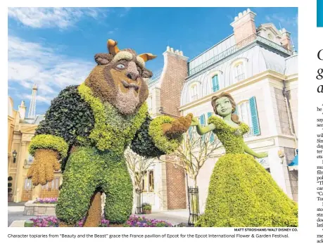  ?? MATT STROSHANE/WALT DISNEY CO. ?? Character topiaries from “Beauty and the Beast” grace the France pavilion of Epcot for the Epcot Internatio­nal Flower & Garden Festival.