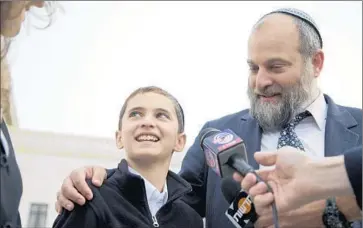  ?? Carolyn Kaster Associated Press ?? THE RULING is a defeat for Menachem and Ari Zivotofsky, seen last fall. The family sued to have the boy’s passport list his birthplace as “Jerusalem, Israel,” but identifyin­g the city as part of Israel is against U.S. policy.