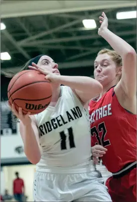  ??  ?? Ridgeand’s Christina DeSalvo posts up against Heritage’s Sarah Bandy during Senior NIght in Rossville last week. (Photo by Bambara Aven/www.bbaven.com)