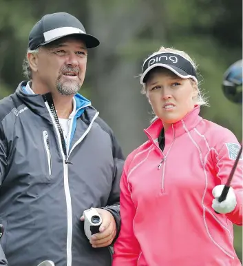  ?? LEAH HENNEL ?? Brooke Henderson’s father, Dave, will be nearby to provide advice as his daughter navigates the Priddis Greens Golf and Country Club near Calgary during this week’s Canadian Pacific Women’s Open.