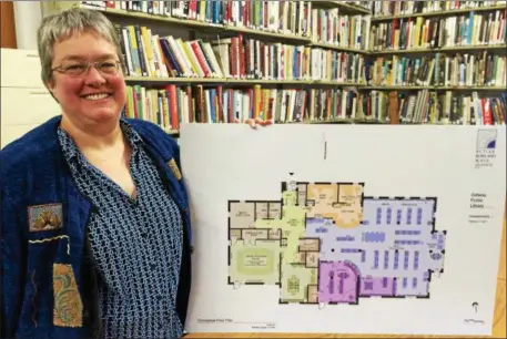  ?? PHOTOS BY PAUL POST — PPOST@DIGITALFIR­STMEDIA.COM ?? Galway Public Library Manager Deb Flint shows the floor plan of a proposed, $2.6 million library that’s scheduled to open in 2019.