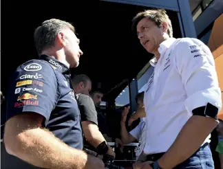  ?? ?? Horner (left) was unhappy with the comments Wolff (right) made regarding Red Bull’s spending, but the FIA has since confirmed Horner’s team did indeed breach the cost cap