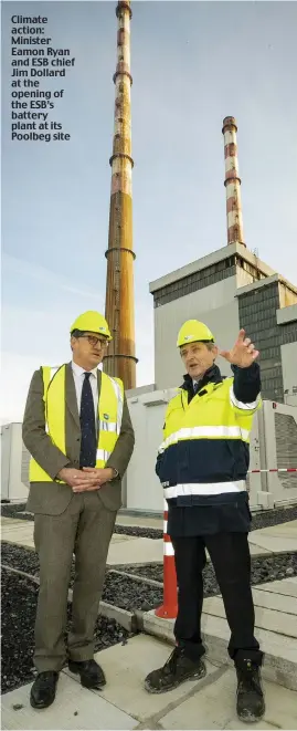  ?? ?? Climate action: Minister Eamon Ryan and ESB chief Jim Dollard at the opening of the ESB’s battery plant at its Poolbeg site