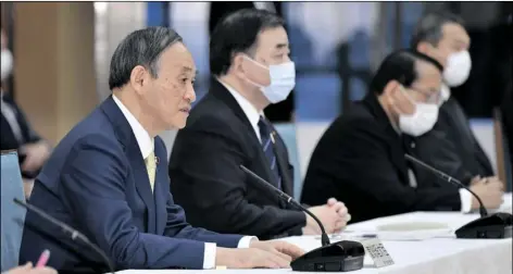  ?? JAPANESE PRIME MINISTER YOSHIHIDE SUGA YOSHITAKA SUGAWARA/AP ?? (left) attends a cabinet meeting at his official residence in Tokyo Tuesday.