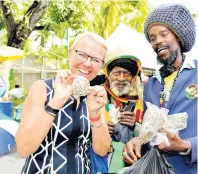  ?? PHOTOS BY KENYON HEMANS ?? From left: Head of European Union Delegation, Ambassador Malgorzata Wasilewska, buys moringa seeds from Edgar Brown (centre) and Edgpar Pusey.