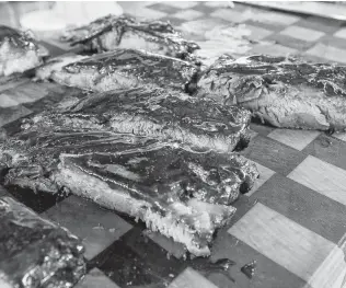  ?? Photos by Marvin Pfeiffer / Staff photograph­er ?? Sliced St. Louis-style pork ribs cooked by barbecue champ cook Corey Flores used the same recipe that won last year’s San Antonio Rodeo Bar-B-Que Cook-off.