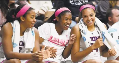  ?? Jessica Hill / Associated Press ?? From left, UConn’s Megan Walker, Crystal Dangerfiel­d and Napheesa Collier look on from the bench during the second half on Saturday.