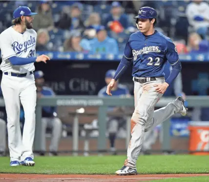  ?? TNS ?? The Brewers' Christian Yelich scores in front of Royals starting pitcher Jason Hammel on a double by Travis Shaw.