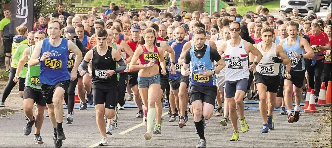  ?? Picture: Chris Davey FM20256585 ?? Competitor­s at the start of Ashford & District RRC’s 10 and 5-mile races at Sandyhurst Lane on Sunday. Report and more pictures, page 38