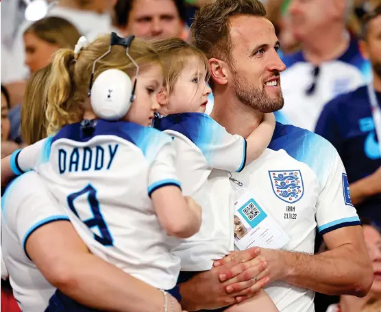  ?? ?? Happy as Harry: Captain Harry Kane celebrates the team’s win with his daughters Ivy, five, and Vivienne, four, yesterday