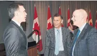  ?? JUSTIN TANG THE CANADIAN PRESS FILE PHOTO ?? Finance Minister Bill Morneau, left, speaks with Hassan Yussuff, president of the Canadian Labour Congress, and Perrin Beatty, president of the Canadian Chamber of Congress. Beatty is pushing Morneau for more money to keep workers employed.