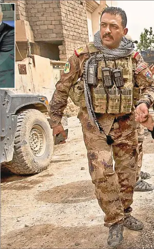  ??  ?? POSTAL DE GUERRA. Un soldado iraquí asiste a una mujer en Mosul, donde las fuerzas regulares, de composició­n chiíta, libran una cruenta batalla contra los sunitas de Estado Islámico.