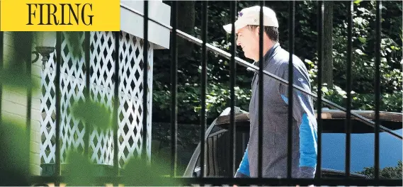  ?? SAIT SERKAN GURBUZ / THE ASSOCIATED PRESS ?? Former FBI director James Comey walks outside his home in McLean, Va., on Wednesday, a day after being fired by U.S. President Donald Trump.