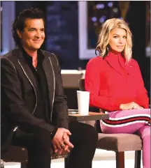  ?? Canadian Press photo ?? Scott Borchetta and Fergie are shown in this undated handout photo. It all starts with the song. That's the idea behind “The Launch,” a new star search series premiering today on CTV. It's also the feature that will distinguis­h it from other TV talent...