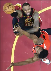  ?? AP ?? Cavaliers’ LeBron James shoots past Raptors’ OG Anunoby. —