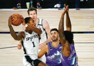  ?? Kevin C. Cox / Associated Press ?? If the Spurs are to exceed expectatio­ns this season, LonnieWalk­er IV and the team’s other young players will have to step up as they did this summer in the NBA bubble.