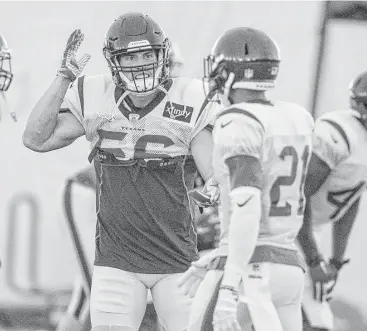  ?? Brett Coomer / Houston Chronicle ?? Linebacker Brian Cushing, left, has taken a position of leadership on the Texans’ defense and has the respect of his teammates after overcoming serious injuries.