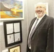  ??  ?? Nigel Williams, Head of Leighton Park School, alongside a striking piece by Ellen Ging in acrylic titled “The Window”