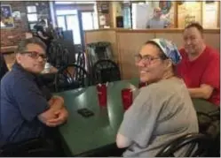  ?? PEG DEGRASSA - MEDIANEWS GROUP ?? Aldan residents Tom Clark, left, his wife Paulette Clark, center, and her brother Richard Nyiri, right, wait for their final meal at the current Italian Delight location which closed for good Sunday.
The three customers dined at Italian Delight at least once a week. It has been their favorite restaurant for decades.