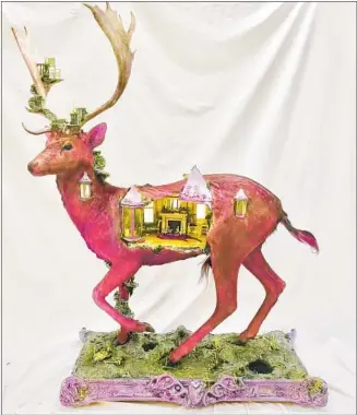  ??  ?? “VIOLET KNIGHT” by Weston houses a castle scene inside a preserved male fallow deer.