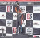  ?? GENTRY / USA TODAY SPORTS MARVIN ?? Arrow McLaren SP driver Pato O'Ward celebrates with champagne after winning the Grand Prix of Alabama at Barber Motorsport­s Park.