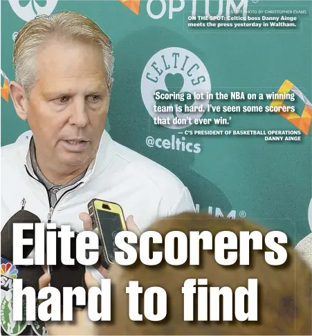  ?? STAFF PHOTO BY CHRISTOPHE­R EVANS ?? ON THE SPOT: Celtics boss Danny Ainge meets the press yesterday in Waltham.