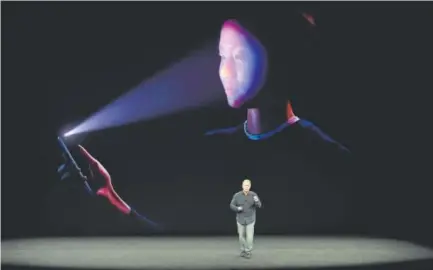  ??  ?? Philip Schiller, senior vice president of worldwide marketing at Apple, introduces the iPhone X last week during a media event at Apple’s new headquarte­rs in Cupertino, Calif.