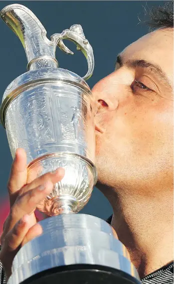  ?? PETER MORRISON/THE ASSOCIATED PRESS ?? Francesco Molinari of Italy has a kiss for the Claret Jug after winning the 147th British Open title by two strokes Sunday in Carnoustie, Scotland.