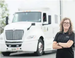  ?? GRAHAM HUGHES / THE CANADIAN PRESS ?? Vivianne Carbonneau, who has been hauling freight for two years, hopes to encourage more women to enter the trucking industry, which she admits is a “guys’ culture.”