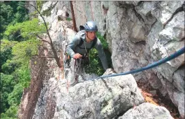  ?? Associated Press photo ?? This photo guide Adam Happensack crosses the Old Ladies Traverse, a food-wide ledge high on the east face of Seneca Rocks and among its easiest routes in West Virginia.