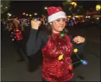  ?? PHOTO VINCENT OSUNA ?? Natalia Nero, 12, and the Frank Wright Middle School drill team perform a routine during the 16th annual Parade of Lights held Friday night in Imperial.