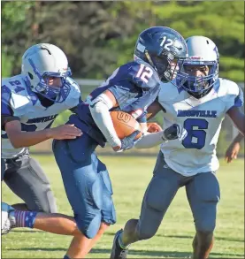  ?? Beth Chappelear ?? Heritage’s Cooper Chappelear is pursued by Rossville’s Sammuel Ramirez (left) and Decoda Davenport during Thursday’s clash in Rossville. The Generals were able to leave town with a narrow 30-28 win.