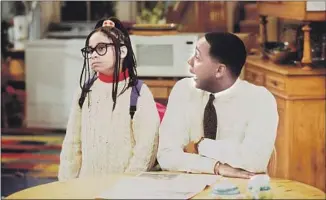  ?? Craig T. Mathew ABC ?? RAVEN-SYMONÉ, then 9, with Mark Curry in an episode of “Hanging with Mr. Cooper.”