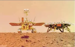  ?? AFP PIC ?? China’s ‘Zhurong’ Mars rover (left) and the landing platform on the surface of Mars, as seen in an image provided by the China National Space Administra­tion (CNSA).