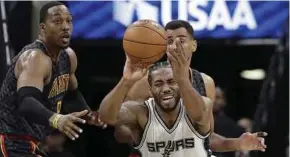  ?? AP PIC ?? Spurs’ Kawhi Leonard with ball in action against Hawks in their NBA game on Monday.