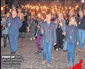  ?? ?? FIRED UP Alan, left, on the Bloody Scotland march through Stirling