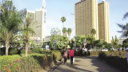  ??  ?? Unidentifi­ed people walk through Memorial Park in Nairobi, Kenya's city centre