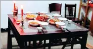  ?? PROVIDED TO CHINA DAILY ?? The table set for the family’s ancestors during Ghost Festival.