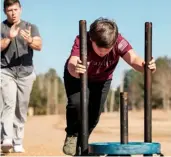  ??  ?? GRAY, TATE’S TRAINER, CAREFULLY WATCHES OVER HIS PROGRESS