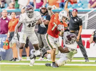  ?? Lauren Sopourn/Getty Images ?? Texas A&M's defense had few answers when it came to slowing down Xavier Restrepo and Miami as the Hurricanes rolled to 374 passing yards, with 241 coming after the catch.