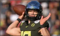  ??  ?? Justin Herbert was a successful quarterbac­k at Oregon, but his success in the NFL could largely depend on an immeasurab­le quality. (AP file photo)