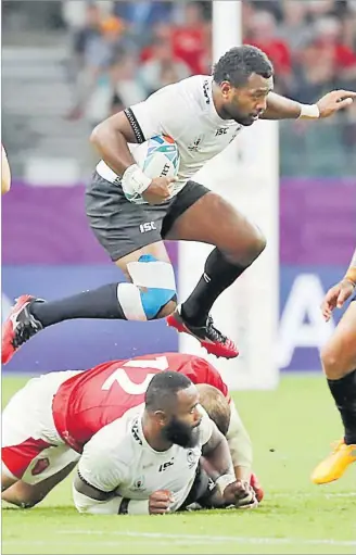  ?? Picture: JOVESA NAISUA ?? Flying Fijians fullback Kini Murimuriva­lu, top, in action against Wales during their pool match at the Oita stadium in Oita, Japan on Wednesday.